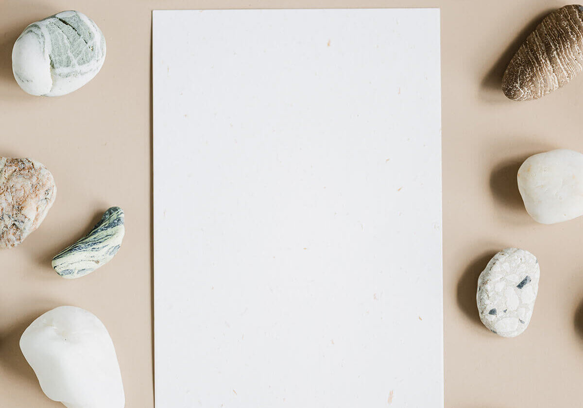 Paper surrounded by rocks